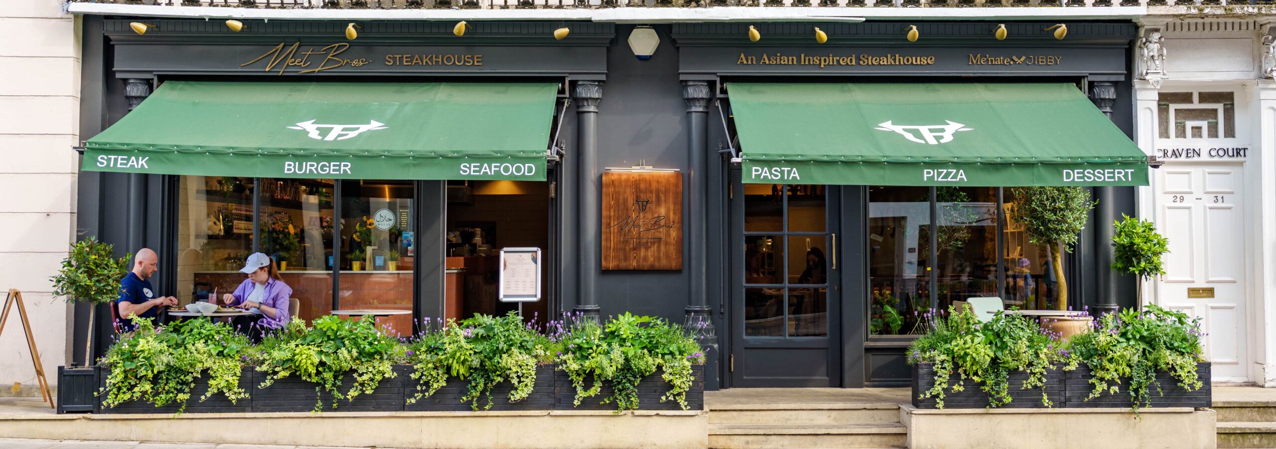 The exterior of Meet Bros steakhouse in London down the road from Paddington station